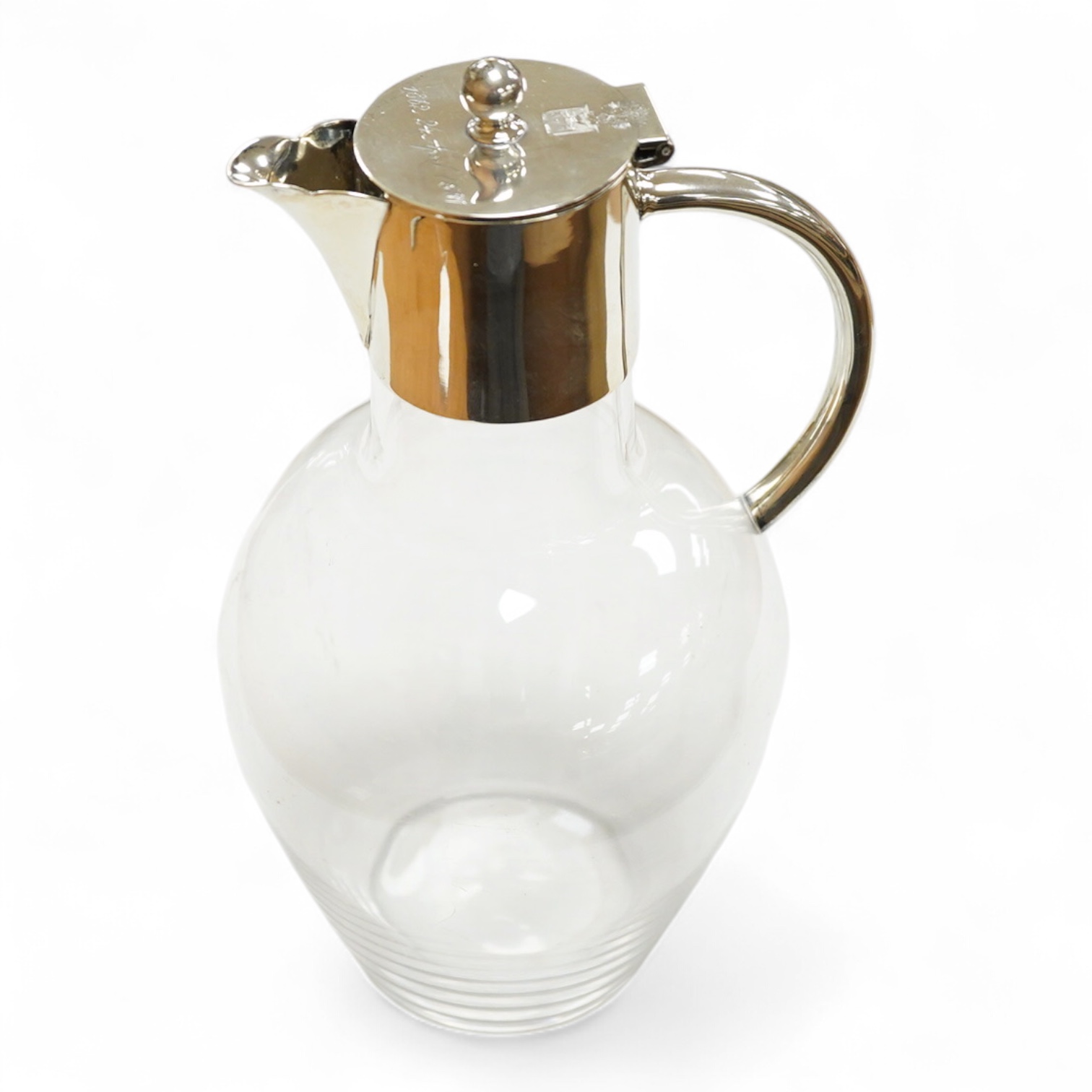 A late Victorian silver mounted glass claret jug, by John Newton Mappin, Sheffield, 1886, with engraved crest and anniversary dates, height 25.5cm.
